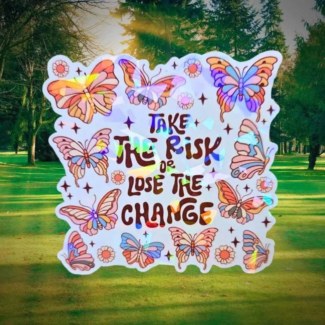 Gem holographic Take the Risk or Lose the Chance sticker with butterflies and flowers, motivational positive quote design for journals and laptops