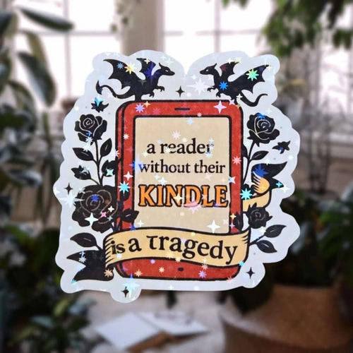 Star holographic A Reader Without Their Kindle Is a Tragedy sticker with e-reader, bats, and floral details, gothic cozy design for book lovers