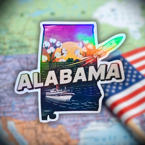 Rainbow holographic Alabama state sticker with rocket, cotton fields, and riverboat—southern heritage souvenir for maps and journals.
