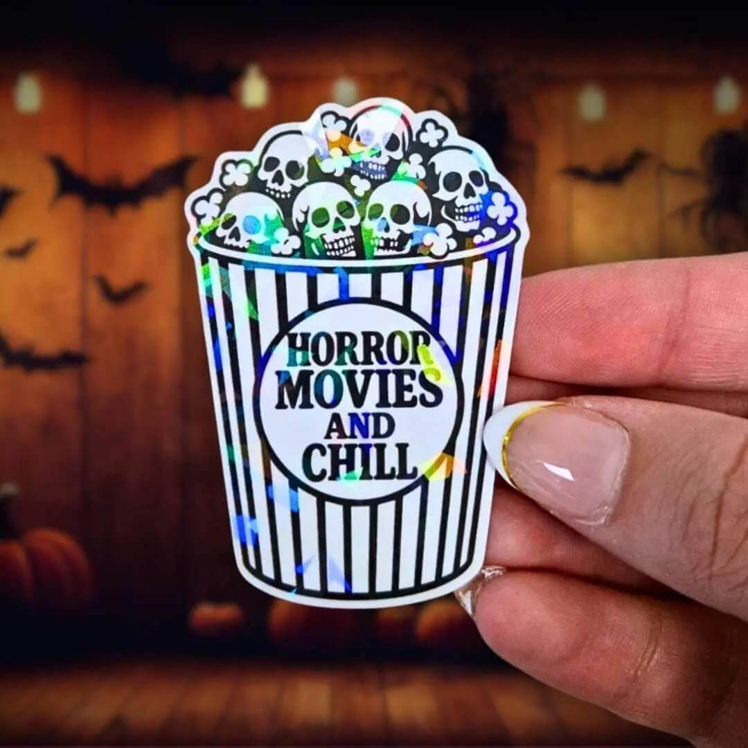 Horror Movies and Chill - Sticker Holographic Popcorn Bucket with Skulls | Spooky Halloween Vinyl Sticker for Laptop, Water Bottle, Journal - Holographic Sticker | The TabbyLoaf