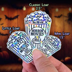 Horror Movies and Chill - Sticker Holographic Popcorn Bucket with Skulls | Spooky Halloween Vinyl Sticker for Laptop, Water Bottle, Journal - Holographic Sticker | The TabbyLoaf