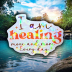 Gem holographic I Am Healing More and More Every Day sticker with gradient lettering and star accents, positive affirmation design for journals and mirrors