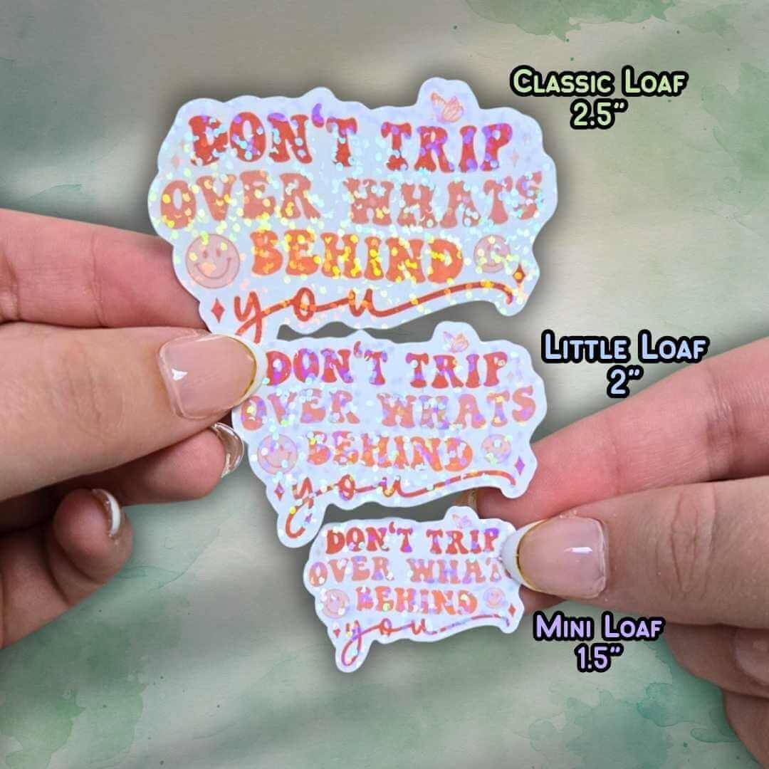 Don’t Trip Over What’s Behind You Sticker – Holographic Motivational Quote Vinyl Decal | Laptop, Journal, or Water Bottle Sticker
