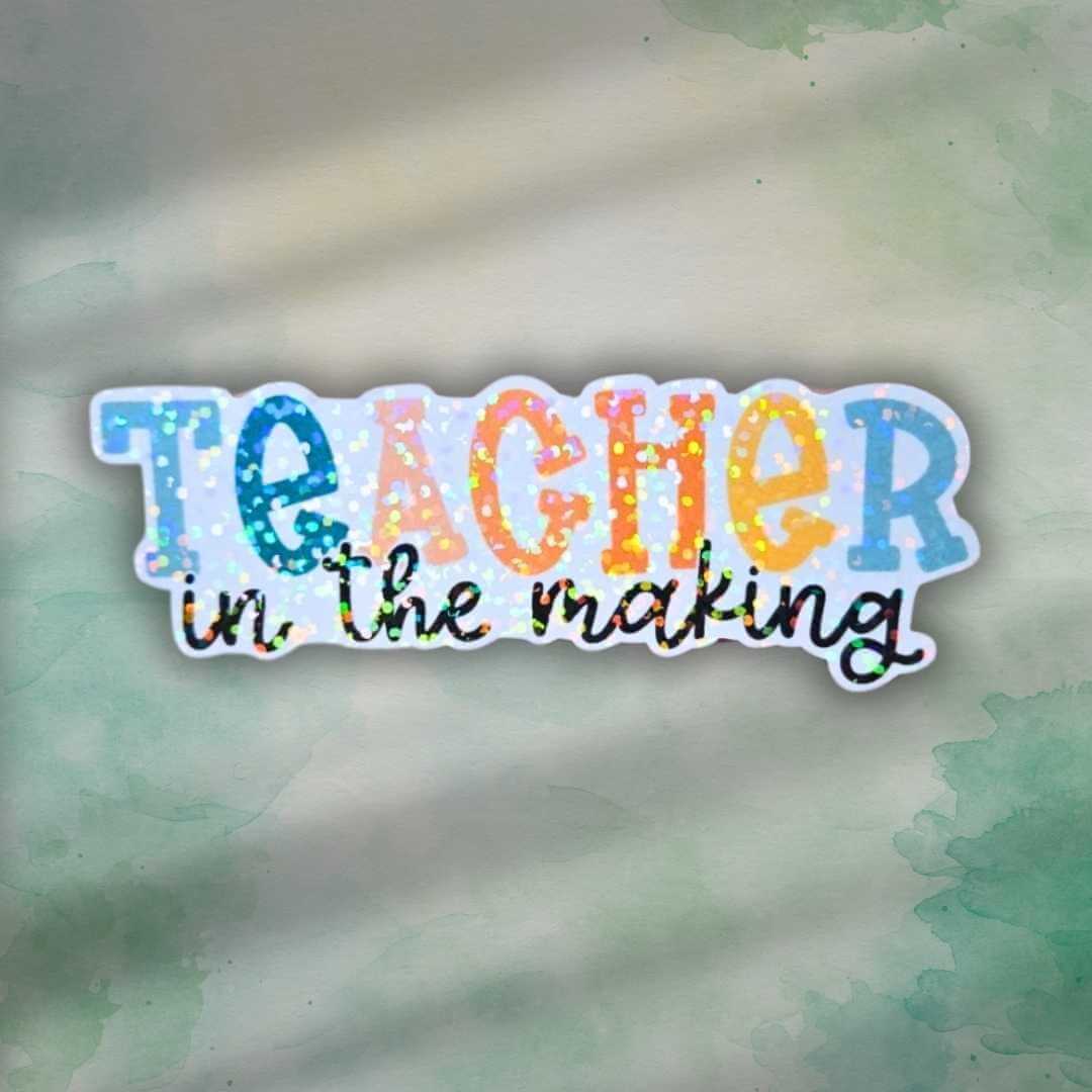 Teacher in the making holographic sticker
Teacher gift
education teacher gift

Celebrate the journey of becoming a teacher with this vibrant holographic vinyl sticker! Perfect for student teachers, education majors, or anyone working toward their teaching career. With its eye-catching sparkle and motivational design, this sticker makes a thoughtful little gift for graduations, first days of student teaching, or just a boost of encouragement perfect for laptops, water bottles notebooks clipboards