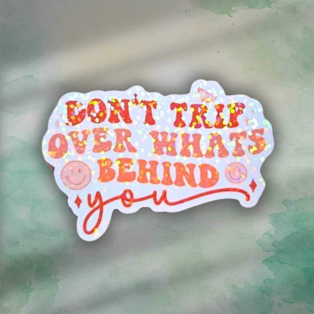 Don’t Trip Over What’s Behind You Sticker – Holographic Motivational Quote Vinyl Decal | Laptop, Journal, or Water Bottle Sticker