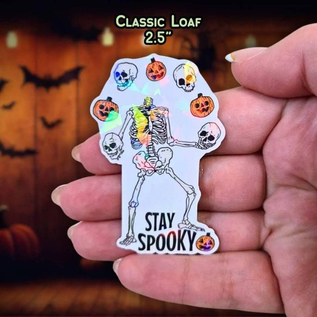 Stay Spooky - Sticker Holographic Skeleton Juggling Skulls & Pumpkins | Cute Gothic Halloween Vinyl Sticker for Laptop, Water Bottle - Holographic Sticker | The TabbyLoaf