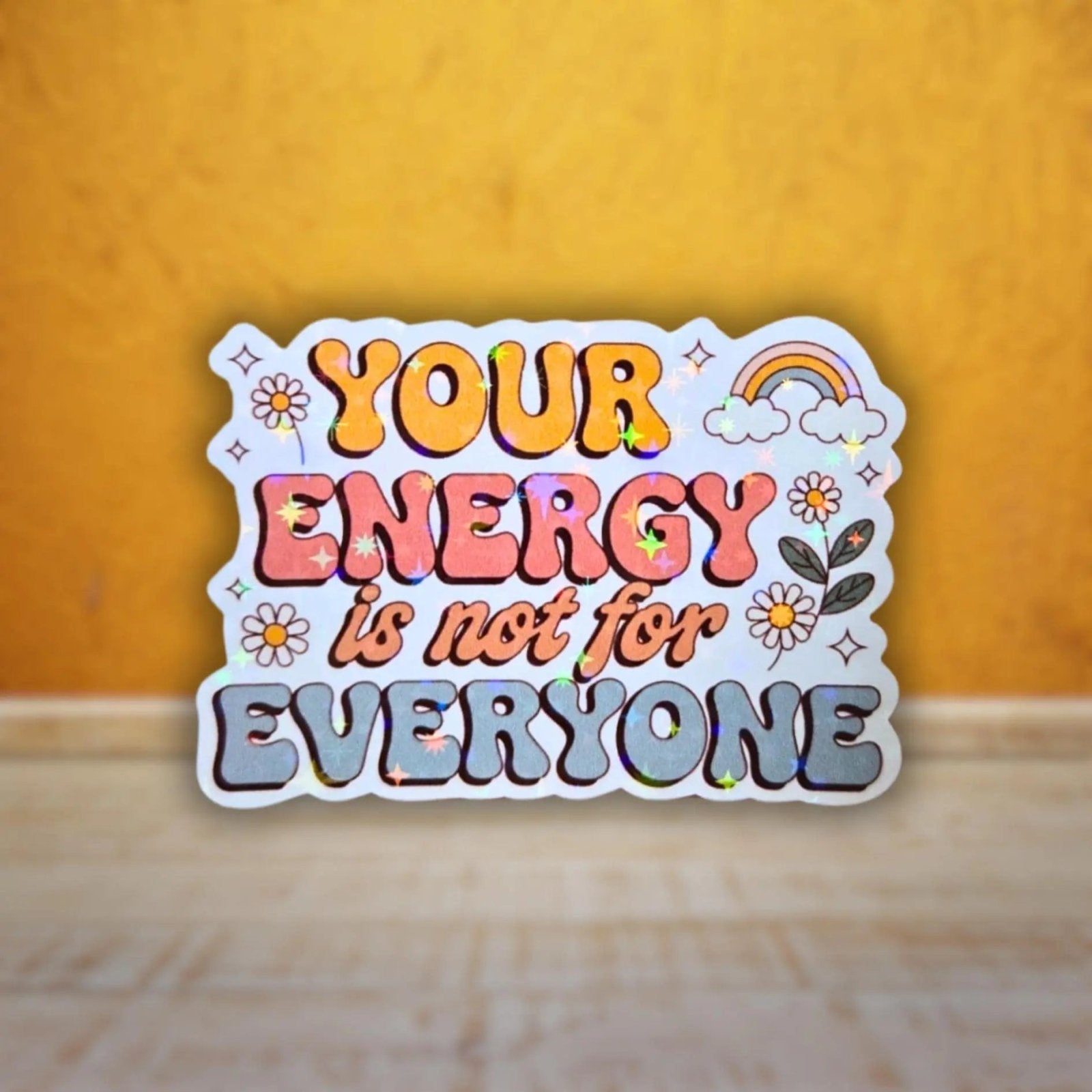 Star holographic Your Energy Is Not For Everyone sticker with rainbow, daisies, and retro lettering, positive self-love affirmation design for laptops and mirrors